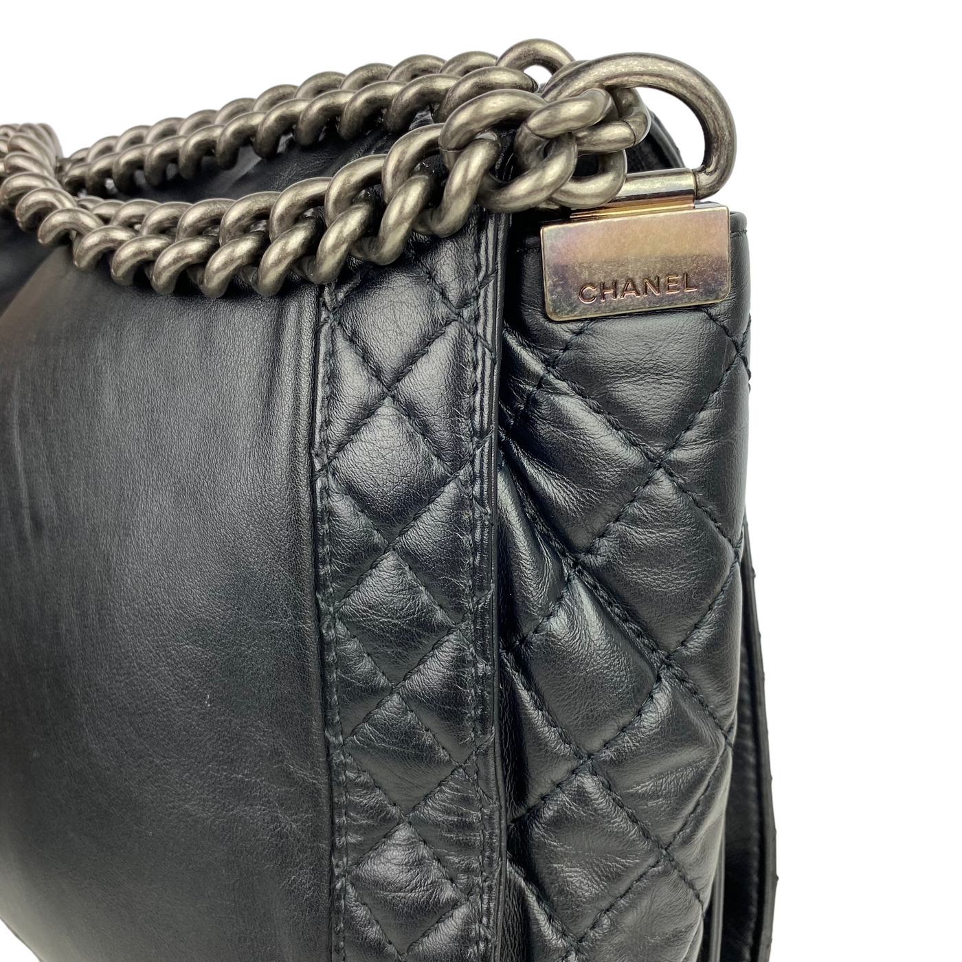 Chanel black Enchained XL Boy Bag hardware close up