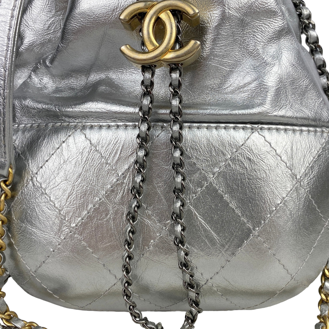 CHANEL DESIGNER SMALL GABRIELLE SILVER BUCKET BAG SIDE BOTTOM CLOSE UP